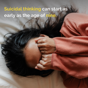 young person laying on the bed with hands covering her face. Text reading: suicidal thinking can start as early as the age of nine. 